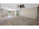 Open-concept living room with natural light and seamless flow to outdoor area at 70 Cypress Pl, Oldsmar, FL 34677