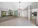 Open living area with neutral flooring, tile, and plenty of natural light at 70 Cypress Pl, Oldsmar, FL 34677