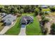 Bird's eye view of the house, with its backyard bordering a serene waterway surrounded by trees at 7054 Rosemont Dr, Englewood, FL 34224