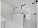 Modern bathroom with a frameless shower, sleek fixtures, and a white vanity at 7054 Rosemont Dr, Englewood, FL 34224
