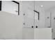 Contemporary shower with glass enclosure, marble-style tile, and modern black hardware at 7054 Rosemont Dr, Englewood, FL 34224
