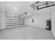 Spacious two-car garage with an automatic door, ready for vehicles and storage with a clean aesthetic at 7054 Rosemont Dr, Englewood, FL 34224