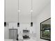 Modern kitchen featuring stainless steel appliances, black hardware, pendant lighting and a large window at 7054 Rosemont Dr, Englewood, FL 34224