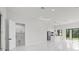 Spacious living area flows into an open-plan kitchen, creating an inviting and modern living space at 7054 Rosemont Dr, Englewood, FL 34224