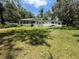 Lush backyard with a sprawling green lawn, the perfect space for outdoor enjoyment and relaxation at 708 Keeling St, Brooksville, FL 34601