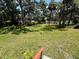 Expansive backyard featuring lush greenery, mature trees, and plenty of space for outdoor activities and relaxation at 708 Keeling St, Brooksville, FL 34601