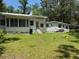 Spacious backyard with a well-maintained lawn, providing ample space for outdoor activities and gatherings at 708 Keeling St, Brooksville, FL 34601