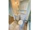 This bathroom features a toilet, sink, mirror, and storage at 708 Keeling St, Brooksville, FL 34601