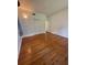 This bedroom includes gleaming hardwood floors and a double-door closet at 708 Keeling St, Brooksville, FL 34601