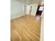 Wood-look flooring, paneled walls, and ceiling fan add charm to this bedroom adjacent to the bathroom and closet at 708 Keeling St, Brooksville, FL 34601