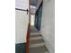 Elevated entrance with steps, featuring a sliding barn door and brightly colored doors at 708 Keeling St, Brooksville, FL 34601