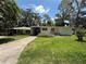 Quaint single story home featuring a well-maintained yard and a covered entrance at 708 Keeling St, Brooksville, FL 34601