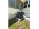 Exterior shot showcasing a modern AC unit and a glimpse of the home's design at 708 Keeling St, Brooksville, FL 34601