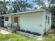 Side exterior view of home with clean lines and a well-kept yard at 708 Keeling St, Brooksville, FL 34601