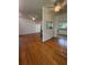 Open-concept living space showcasing hardwood floors and lots of natural light at 708 Keeling St, Brooksville, FL 34601