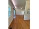 Spacious living room featuring hardwood floors, large windows, and sliding glass doors at 708 Keeling St, Brooksville, FL 34601