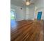 Spacious living room with hardwood floors and a decorative fireplace at 708 Keeling St, Brooksville, FL 34601