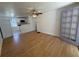 Spacious living room featuring wood floors and a doorway to the kitchen at 708 Keeling St, Brooksville, FL 34601