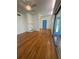 Bright living room with hardwood floors and a fireplace in the corner at 708 Keeling St, Brooksville, FL 34601