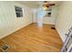 Bright living room features wood floors and view to kitchen at 708 Keeling St, Brooksville, FL 34601