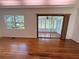Bright and airy sunroom featuring hardwood floors and lots of windows at 708 Keeling St, Brooksville, FL 34601