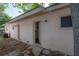 View of back exterior of house with three different entrances at 725 2Nd Ne Ave, Largo, FL 33770