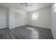 Spacious bedroom with new flooring, ceiling fan, and ample closet space at 725 2Nd Ne Ave, Largo, FL 33770