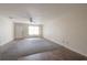Spacious living room with carpet, leading to a tiled kitchen area at 725 2Nd Ne Ave, Largo, FL 33770