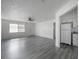 Open living area featuring new flooring, fresh white paint, and a ceiling fan at 725 2Nd Ne Ave, Largo, FL 33770