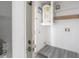 Utility room with storage shelves and water heater at 725 2Nd Ne Ave, Largo, FL 33770