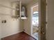 A utility room featuring a water heater, storage shelves and vinyl floors at 725 2Nd Ne Ave, Largo, FL 33770