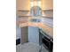 Bathroom features a vanity with granite counters, an octagon mirror, floating shelves, and mosaic tile floors at 8260 32Nd N Ave, St Petersburg, FL 33710