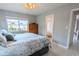 Bright bedroom showcasing a neutral color palette and adjacent bathroom at 8260 32Nd N Ave, St Petersburg, FL 33710