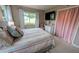 Bedroom showcasing a tv, closet and mosaic floors at 8260 32Nd N Ave, St Petersburg, FL 33710
