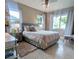 Bedroom with a mosaic floor, a large bed and two windows at 8260 32Nd N Ave, St Petersburg, FL 33710