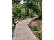A wooden boardwalk winds its way through a thickly vegetated landscape at 8260 32Nd N Ave, St Petersburg, FL 33710