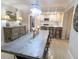 Modern dining area with stylish light fixture and comfortable seating, adjacent to kitchen at 8260 32Nd N Ave, St Petersburg, FL 33710