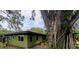 Charming home with a new roof, hurricane windows, and lush landscaping including a mature Banyan tree at 8260 32Nd N Ave, St Petersburg, FL 33710