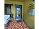 Charming front porch with a blue door, vintage mailbox, and a stylish tiled floor at 8260 32Nd N Ave, St Petersburg, FL 33710
