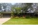 Well-maintained lawn and tropical landscaping accentuate the exterior of this attractive, single story home at 8260 32Nd N Ave, St Petersburg, FL 33710