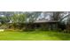 Lush landscaping featuring a variety of tropical plants surrounds this home, creating a private and inviting atmosphere at 8260 32Nd N Ave, St Petersburg, FL 33710