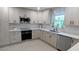 Bright kitchen boasting wood cabinets, stainless appliances, and modern countertops for a stylish cooking space at 8260 32Nd N Ave, St Petersburg, FL 33710