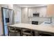 Modern kitchen features stainless steel appliances, quartz countertops, and ample storage at 8260 32Nd N Ave, St Petersburg, FL 33710