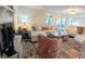 Inviting living room showcasing a fireplace, white sofa, and access to the patio at 8260 32Nd N Ave, St Petersburg, FL 33710
