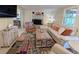 Cozy living room with a white sofa, fireplace, and decorative accents at 8260 32Nd N Ave, St Petersburg, FL 33710