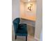 A cozy office nook with a teal chair and unique art, perfect for a home work space at 8260 32Nd N Ave, St Petersburg, FL 33710