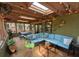 Relaxing screened patio with skylights, comfortable seating, and a ceiling fan for ultimate outdoor enjoyment at 8260 32Nd N Ave, St Petersburg, FL 33710