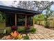 Enclosed patio with ample lighting perfect for entertaining in a tropical setting, complete with custom pavers at 8260 32Nd N Ave, St Petersburg, FL 33710