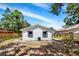 Home's backyard features a fence and an A/C unit at 8603 N 9Th St, Tampa, FL 33604