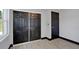 Bedroom featuring neutral paint, large closet, and natural light at 8603 N 9Th St, Tampa, FL 33604